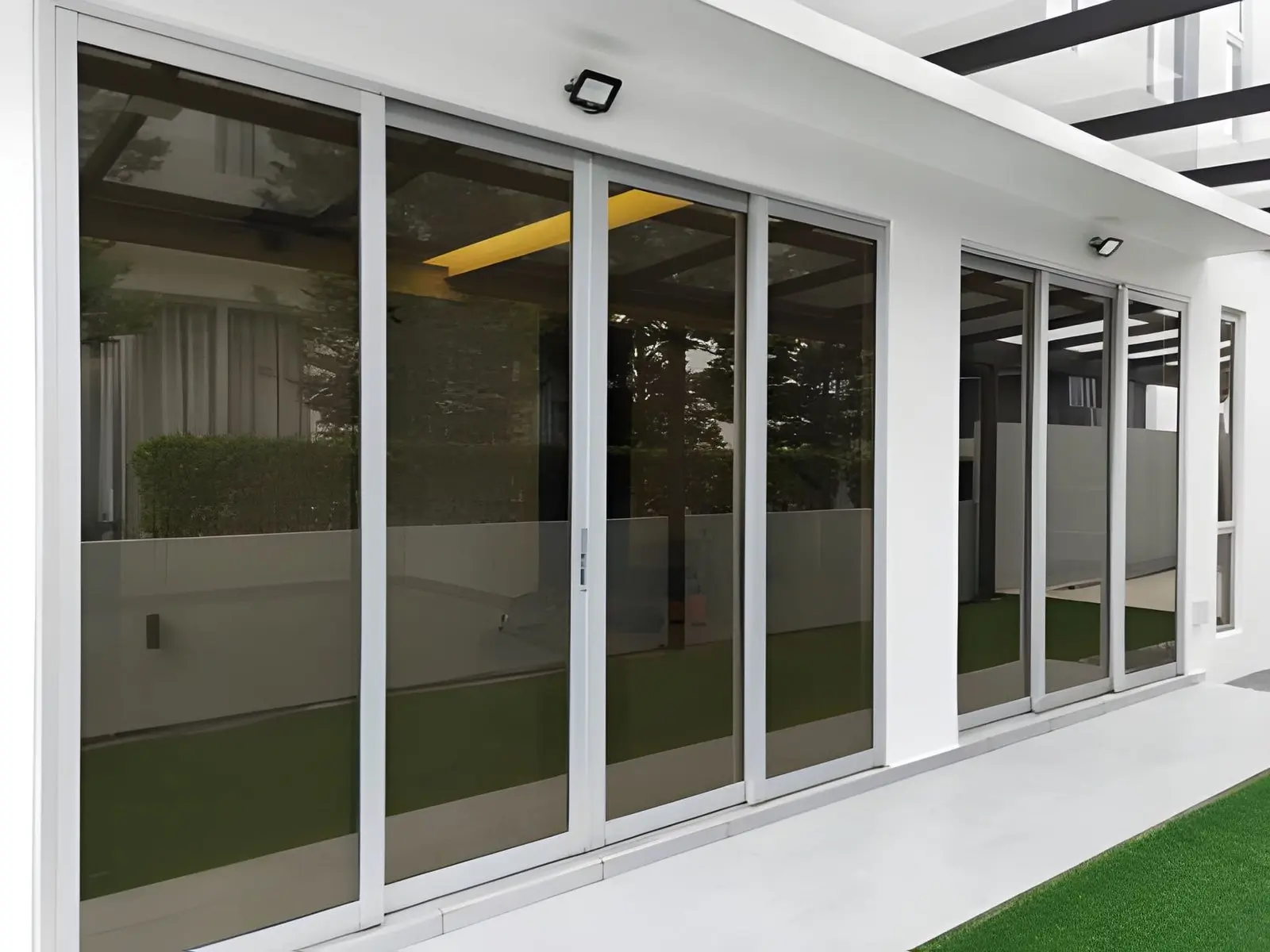 Professional Sliding Glass Door Repair fixing worn rollers for smooth sliding operation and improved door movement