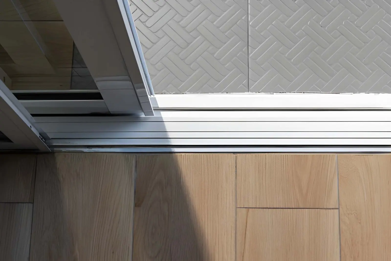 Damaged Sliding Door Track Close-Up - PSL Sliding Door Repair - Boca Raton & Palm Beach Area Sliding Door Track Replacement showing damaged sliding door track before repair work